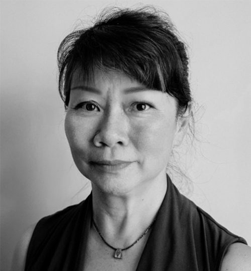 Black and white portrait of a middle-aged woman with a calm expression.